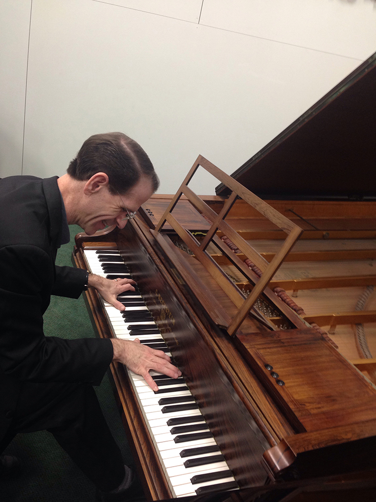 hendricks sitting on the piano